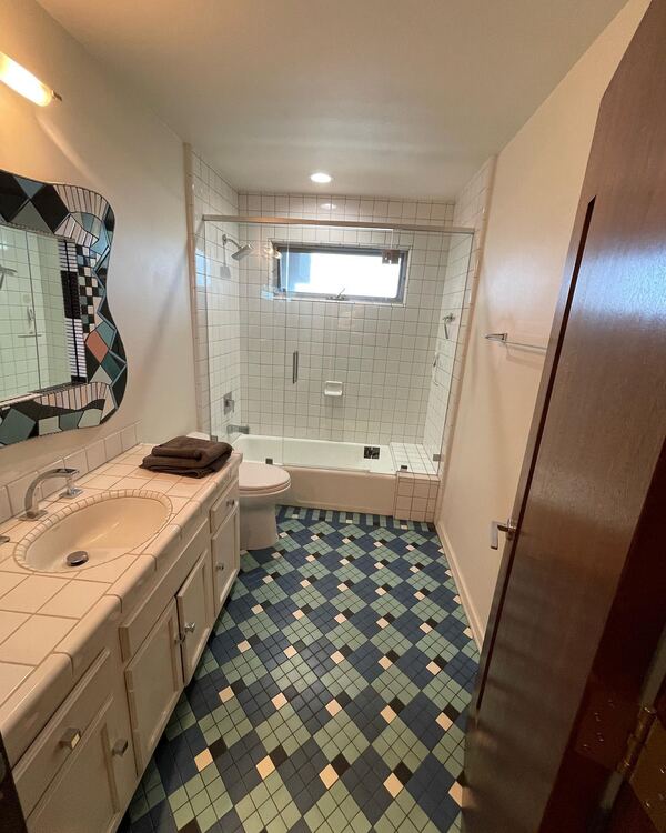 The same bathroom before, with the old tile and vanity